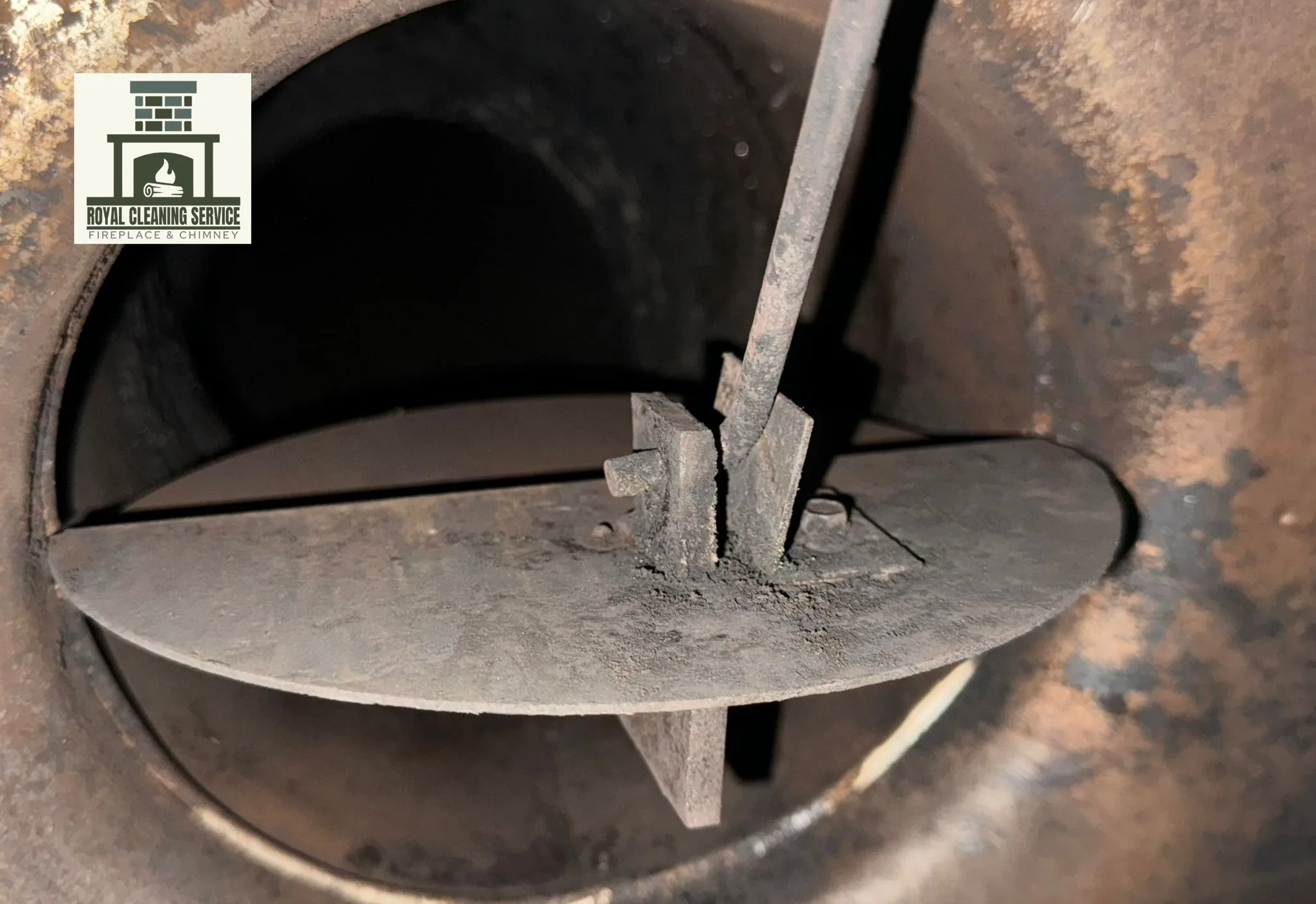 Royal Cleaning Service professional technician performing Stage 3 creosote removal from a Los Angeles chimney flue using rotary brush system