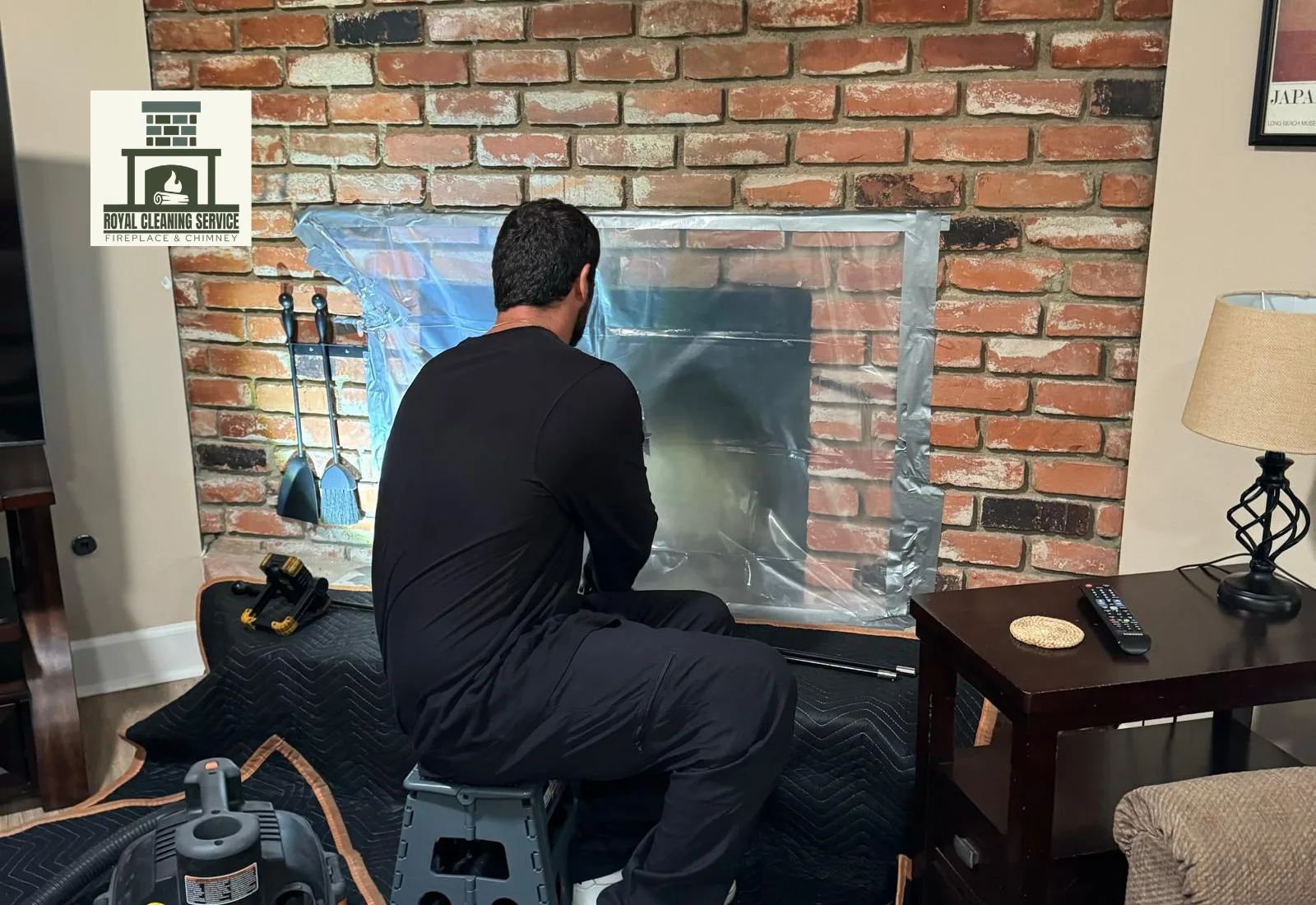 Technician preparing a Los Angeles chimney for inspection and sweeping service