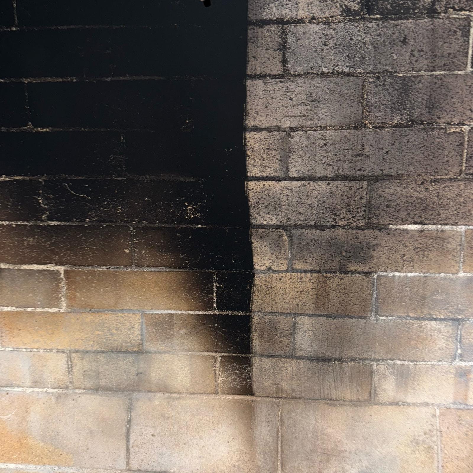 Smoking chimney of a rural cottage house in the woods on the background of mountains